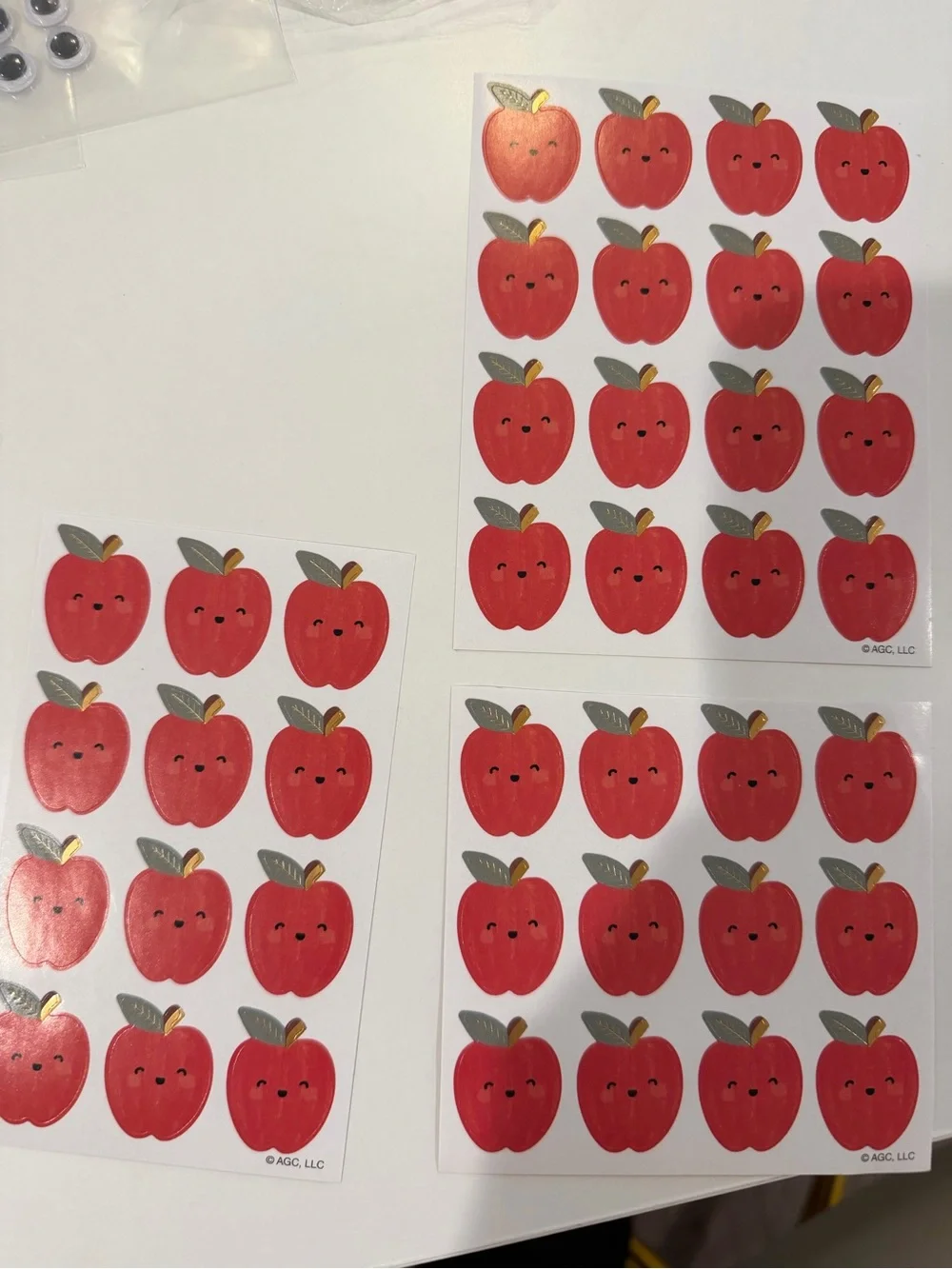 Bundle of back to school apple stickers, googly eyes, & transportation sticker